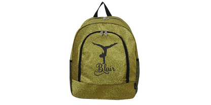 Gold glitter cheer backpack with black trim featuring a gymnast silhouette and custom name “Blair” on the front pocket