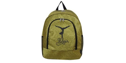 Gold glitter cheer backpack with black trim featuring a gymnast silhouette and custom name “Blair” on the front pocket