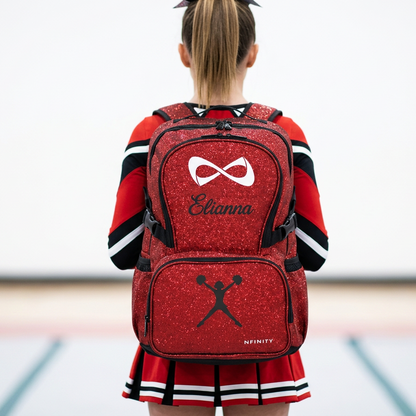 Teen cheerleader wearing a personalized red Nfinity sparkle backpack.