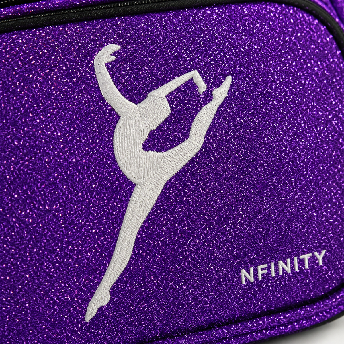Close-up of professional white embroidery stitching on a purple glitter cheer backpack.
