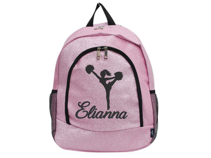 Pink glitter backpack with a high kick cheerleader silhouette and the name Elianna printed on the front