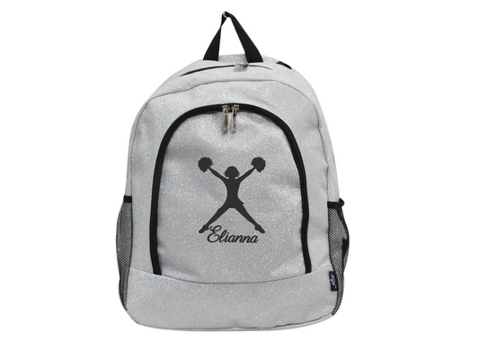 Silver glitter cheer backpack with black cheerleader silhouette and custom name “Elianna” on the front pocket