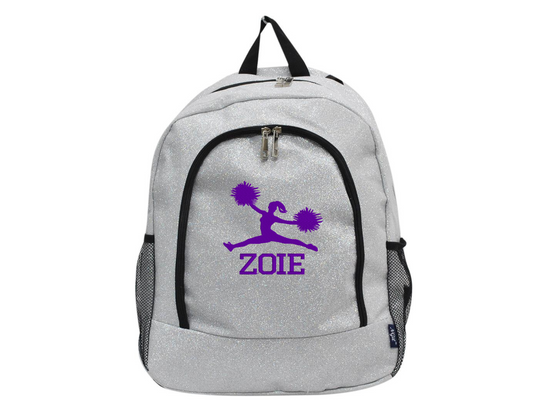 Silver glitter cheer backpack with purple cheerleader silhouette and custom name “Zoie” on the front pocket